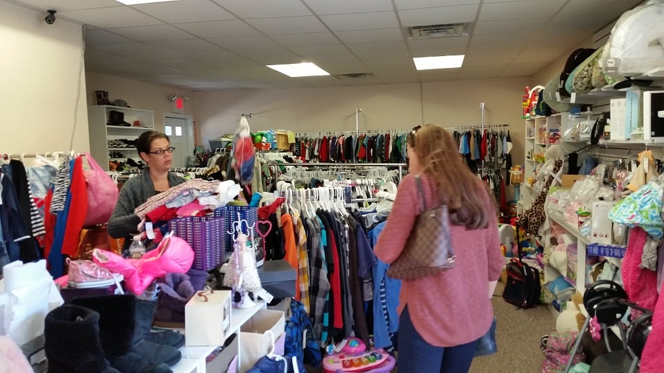 Customers search for children's clothing and other kid-friendly items selling for bargain prices.