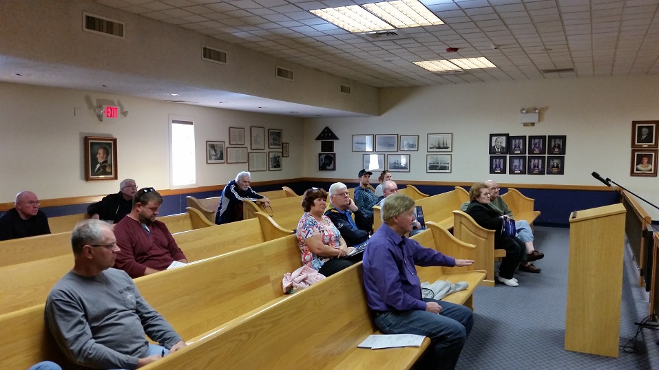 Local residents listen to a presentation on how to possibly reduce their flood insurance premiums.